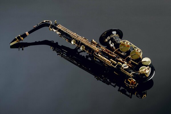 Black saxophone on a black background