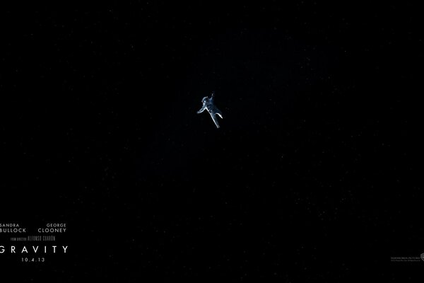 An astronaut is flying in outer space