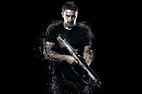 Actor Theo James with a gun