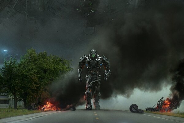 The transformer is walking down the street where there are already fights