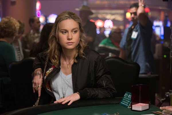 Brie Larson from the movie The Gambler at the card table in the casino