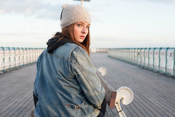 Sophie Terener in a hat on the bridge