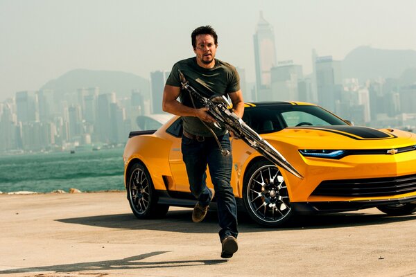 Mark Wahlberg on the background of a car