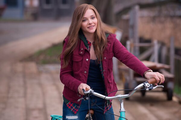 A girl on a bicycle . To live to love