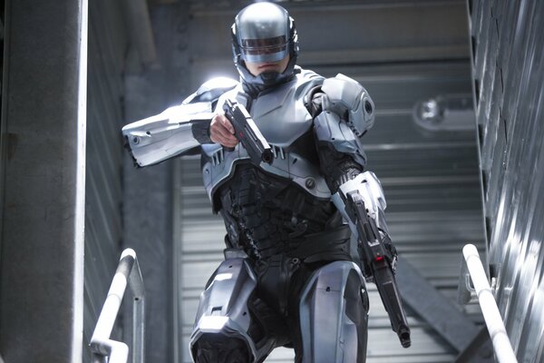 A shot from the movie robocop with pistols