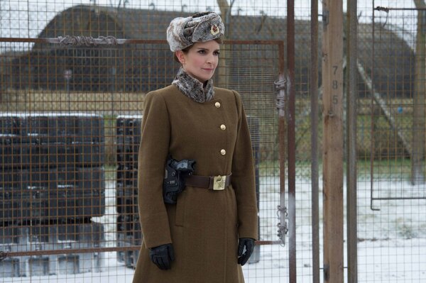 Tina Fey in military uniform at the fence