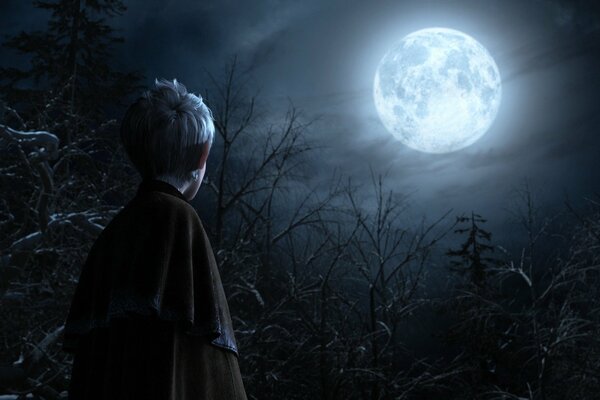 Imagen de un niño en el fondo de los árboles y la Luna