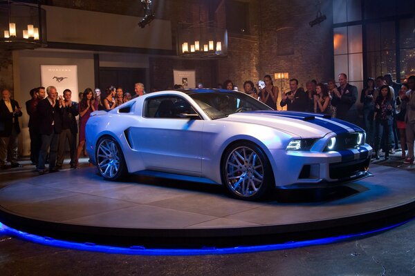 Ford Mustang on a platform with blue backlight