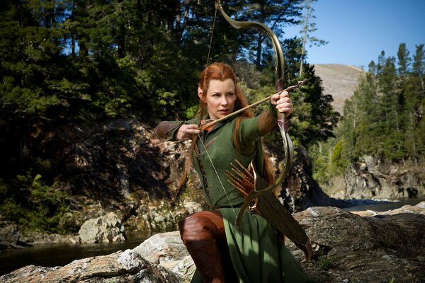 Evangeline Lilly shoots an arrow