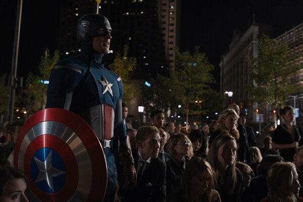 Captain America in the background of the crowd