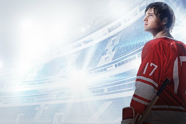 Danila Kozlovsky allo stadio in uniforme da hockey guarda in alto