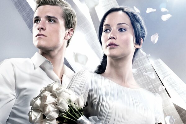 The main actors of the film the Hunger Games in wedding dresses