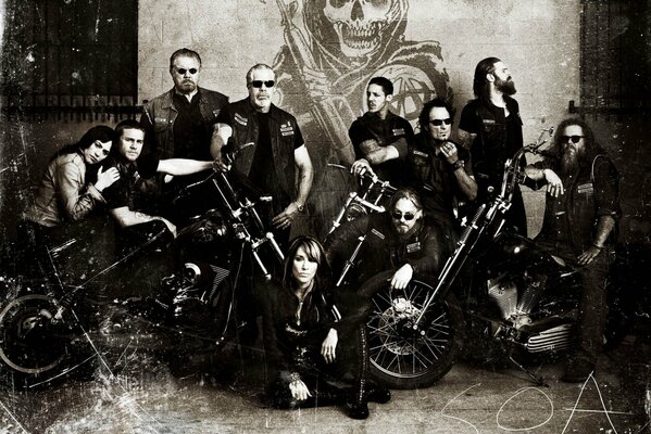 Bikers pose at their motorcycles