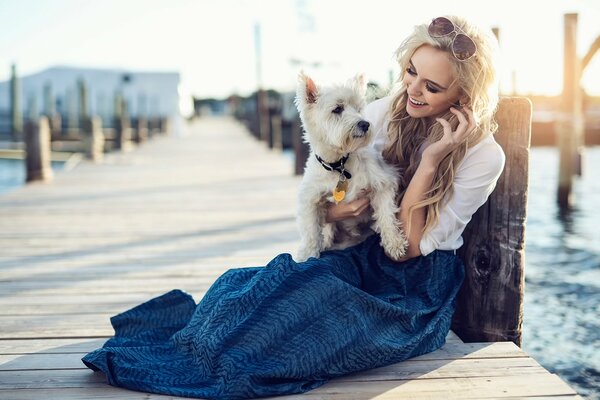 Girl on the dock with a puppy