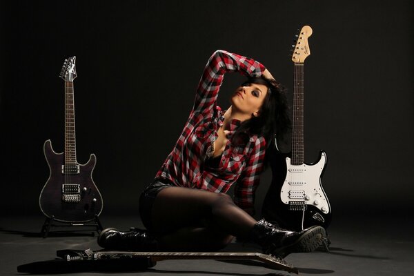 Beautiful girl in shirt and guitar