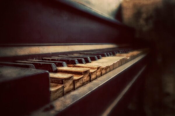 An old black piano. Bokeh