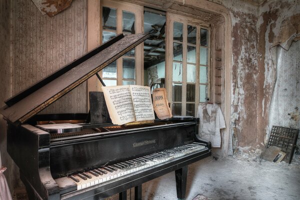 A grand piano in an old communal house