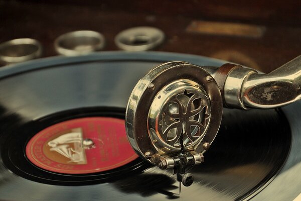 The record is played on a beautiful vintage gramophone