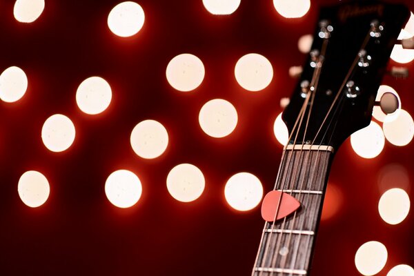 Guitare sur fond de lumières