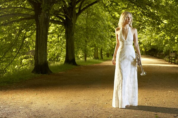 Girl walking in the park with a pipe