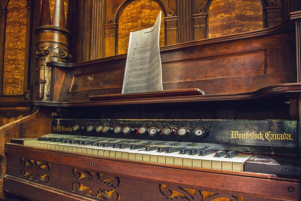 Antique wooden organ with notes