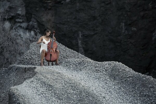 Playing a girl on the cello in the mountains