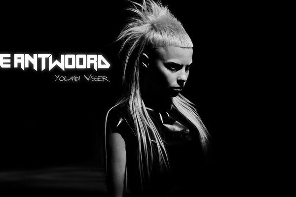 A girl with a mohawk on her head on a dark background