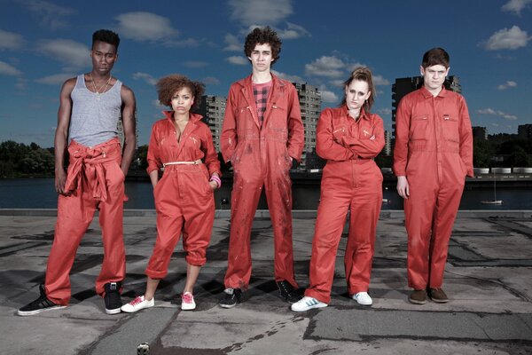 Actors from the TV series Scum in red suits