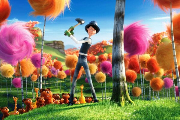 Denis de Vito cuts down fluffy trees on the lawn of the Lorax