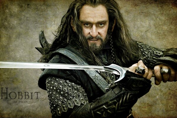 A warrior with a sword in armor from the Hobbit movie