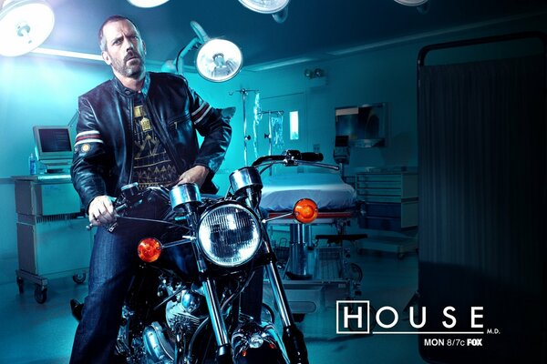 Dr. House on a motorcycle in a hospital room