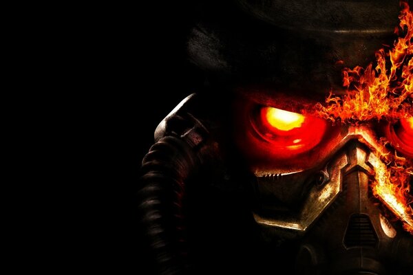 Обои к игре Killzone 3, на которых изображёна маска с пылающими глазами