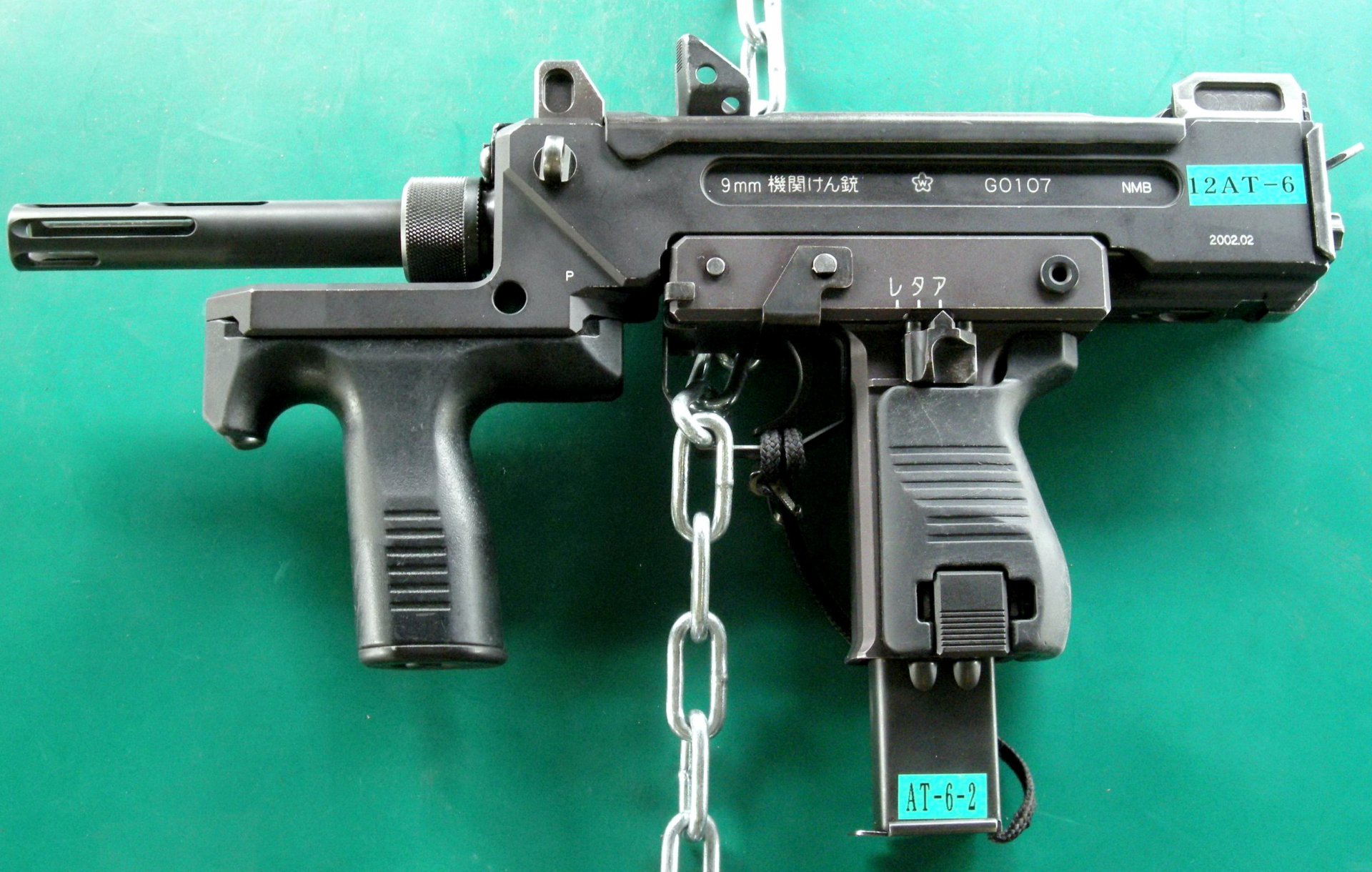 compact submachine gun japan weapon minebea pm-9 9mm machine pistol submachine gun 機関 拳 銃 kyumiri kikan kenjū length 399mm weight 8 kg shop cartridges 9x19 mm tempo fire shots per minute initial speed bullet 1100m.sek from