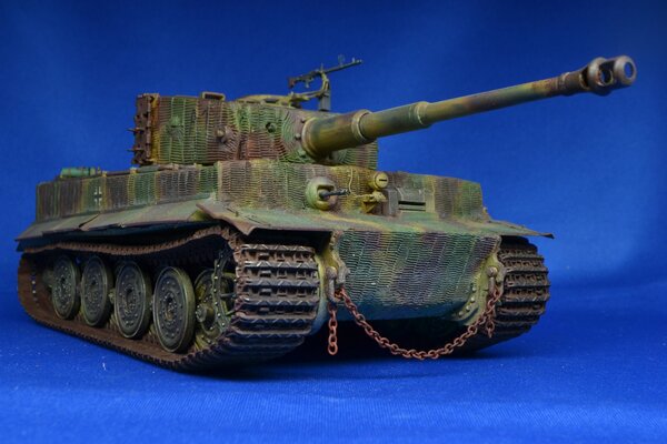 Toy collectible tank model on a blue background
