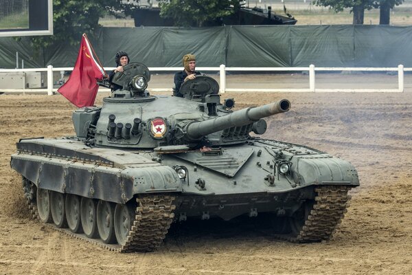 T-72 combat tank with two fighters and a red flag