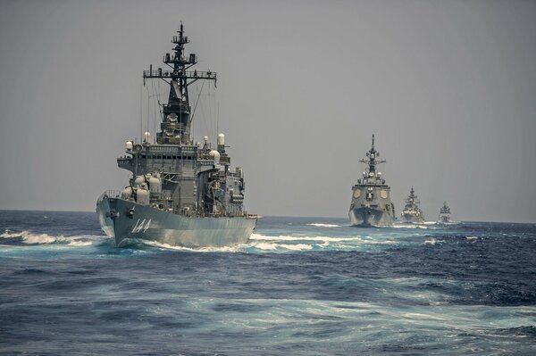 Warships plow the expanses of the sea