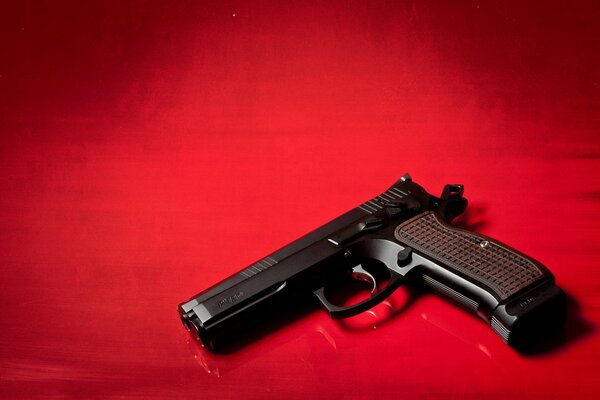 Weapons photo. Photo of the r-120 pistol on a red background