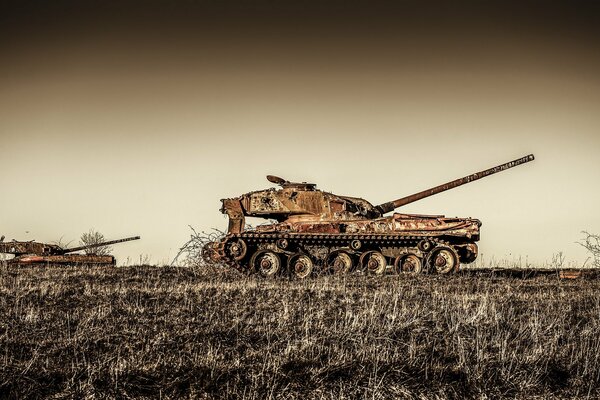 Old rusty tanks in the field