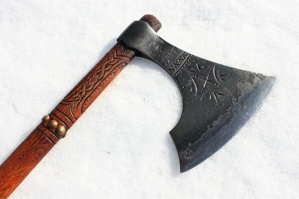 Battle axe with carved patterns