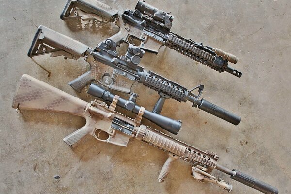 American semi-automatic rifle AR -15. Assault rifles on a beige background. Weapons for self-defense and hunting