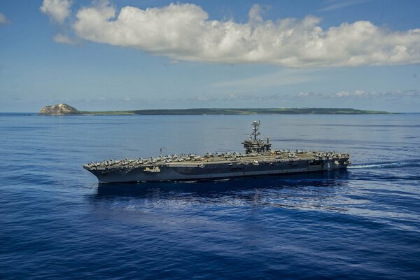 Aircraft carrier type Nimitz at sea in clear weather