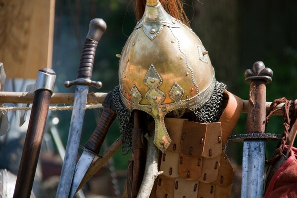 The knight s armor is hanging on the fence