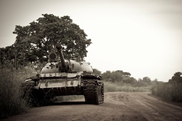 Military armored vehicles on a dusty road