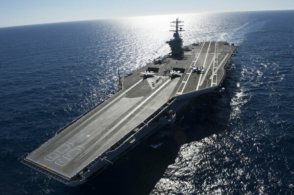 A large warship is sailing on the sea