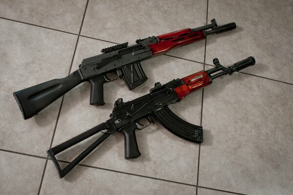 A pair of saiga-12k and aks-74 assault rifles