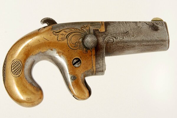 Pocket pistol derringer , white background.