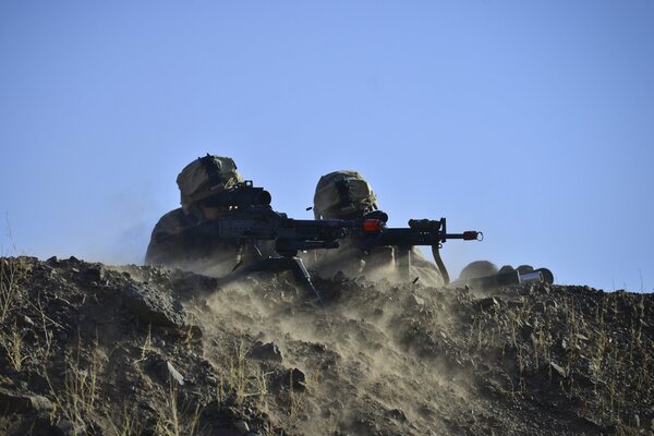 Soldiers in position with weapons in their hands