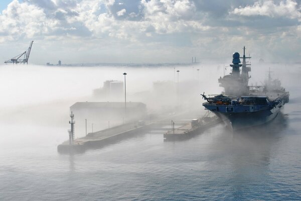 Italian aircraft carrier on the outside in the fog