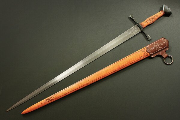 A sword with a beautiful handle on a dark background