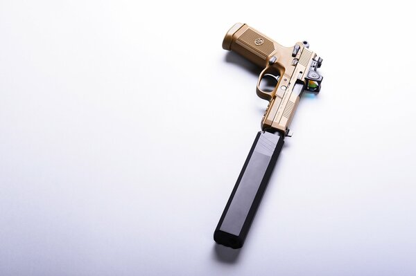 Pistol with a silencer on a white background